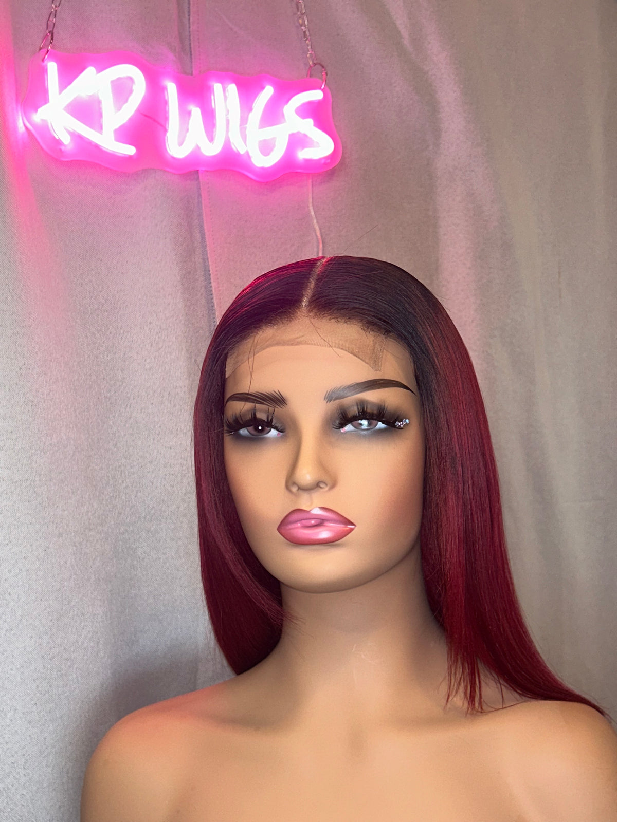 Keisha burgundy bob wig displayed on a mannequin